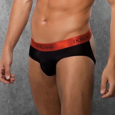 Мужские трусы-джоки с широкой резинкой Интересная модель сексуальных мужских трусов джоки - будоражащая фантазию! Очень лёгкий и мягкий эластичный материал. На поясе вшита стильная пришивная резинка с фирменным логотипом бренда Doreanse. Передняя панель без подкладки. Страна: Турция. Материал: 75% нейлон, 25% эластан.