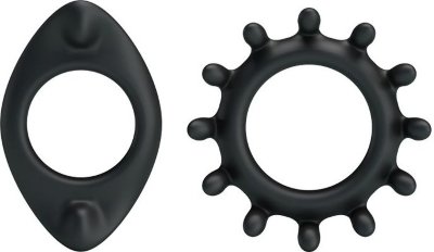 Набор из 2 фигурных эрекционных колец Набор эрекционных колец черного цвета для дополнительной стимуляции. Эластичные, легко растягиваются до необходимого размера. Эта маленькая изюминка поможет украсить сексуальную жизнь - усилить эрекцию и сделать половой акт более продолжительным. Внутренний диаметр колец - 2,5 и 2,7 см. Страна: Китай. Материал: силикон.